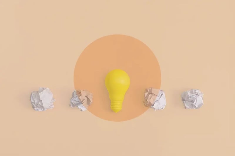 lightbulb with rolled up paper
