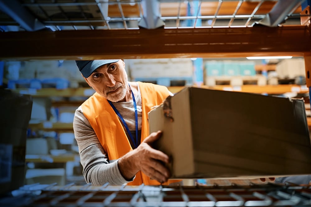 warehouse worker stocking shelves