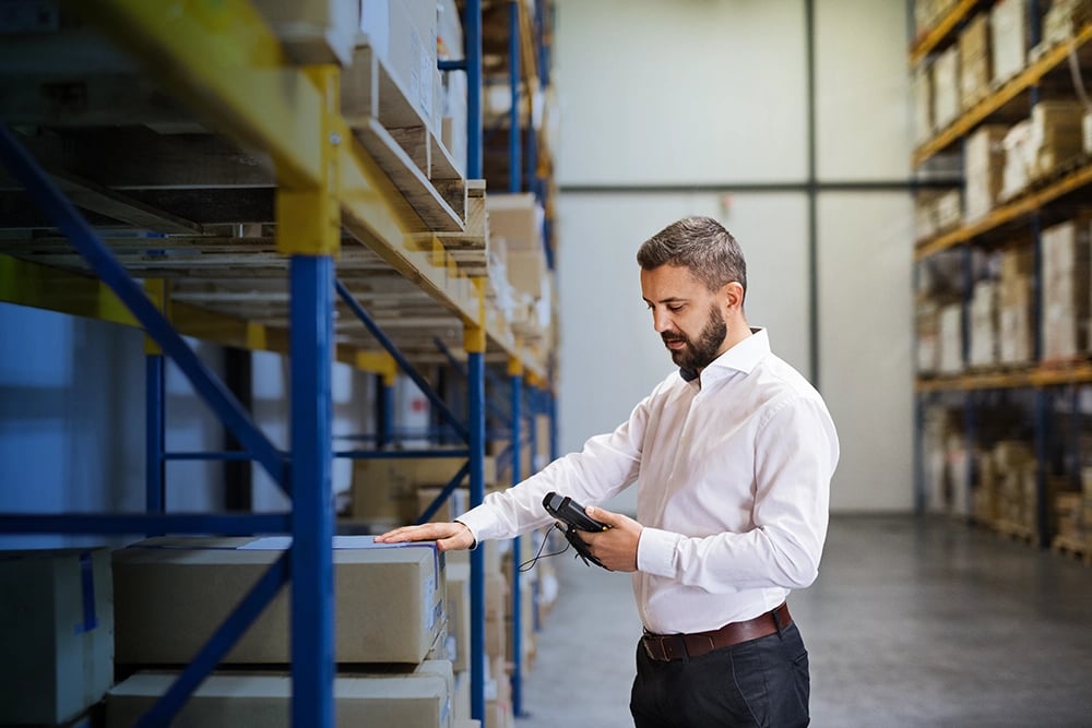 warehouse manager scanning packages