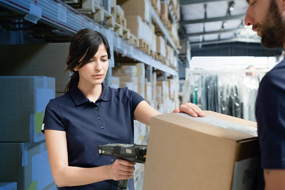 Warehouse workers scanning box
