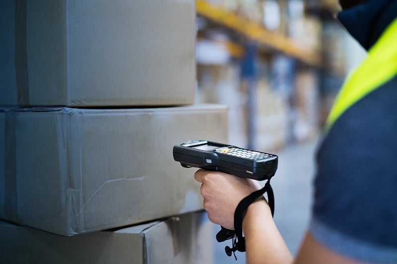 employee scanning boxes