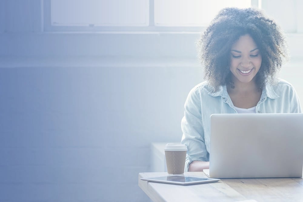 woman on computer with iPad