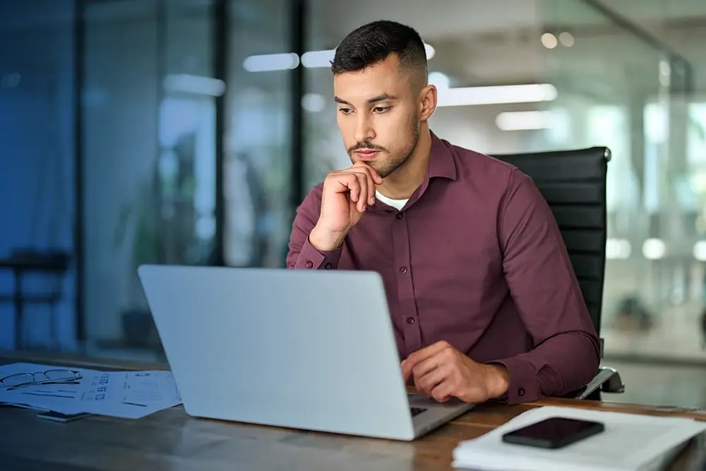 business owner working on laptop