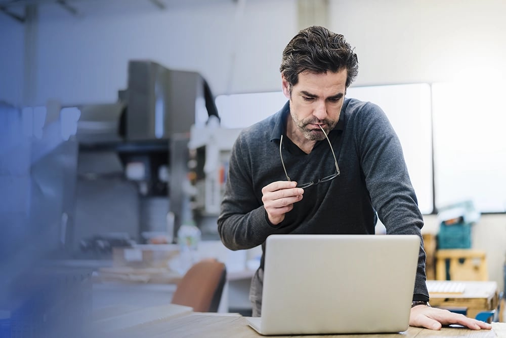 business owner working on laptop